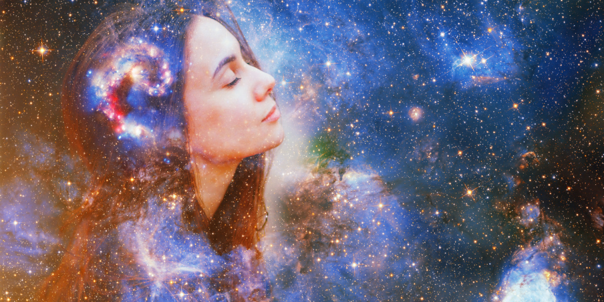 Profile of a woman's face merged with a starry galaxy background.