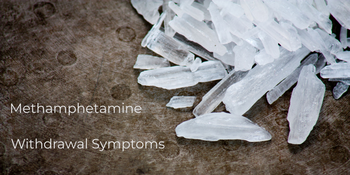 Clear crystal-like shards on a rough surface, text reads