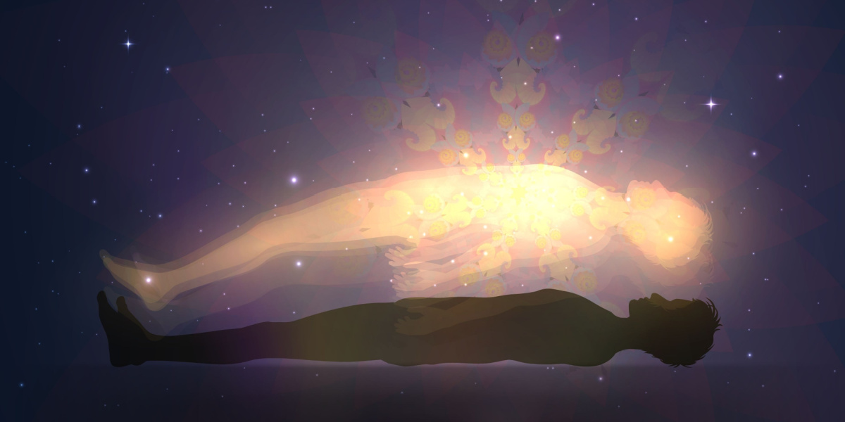 Silhouette of a lying person with glowing light form above them.