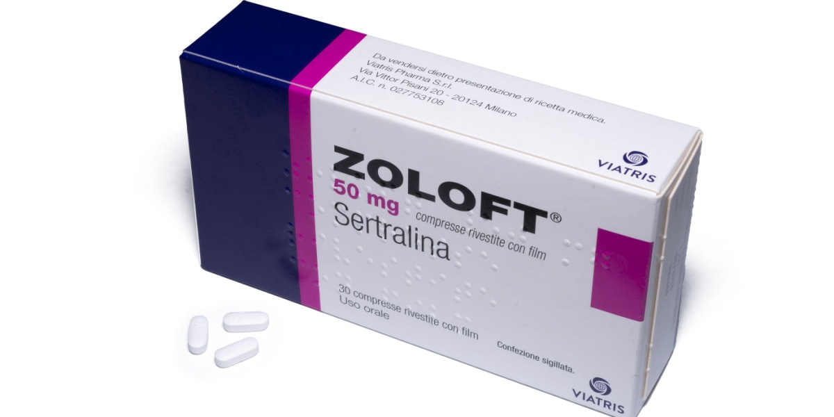 a photo of a box of Zoloft or sertraline with three white pills outside of the box