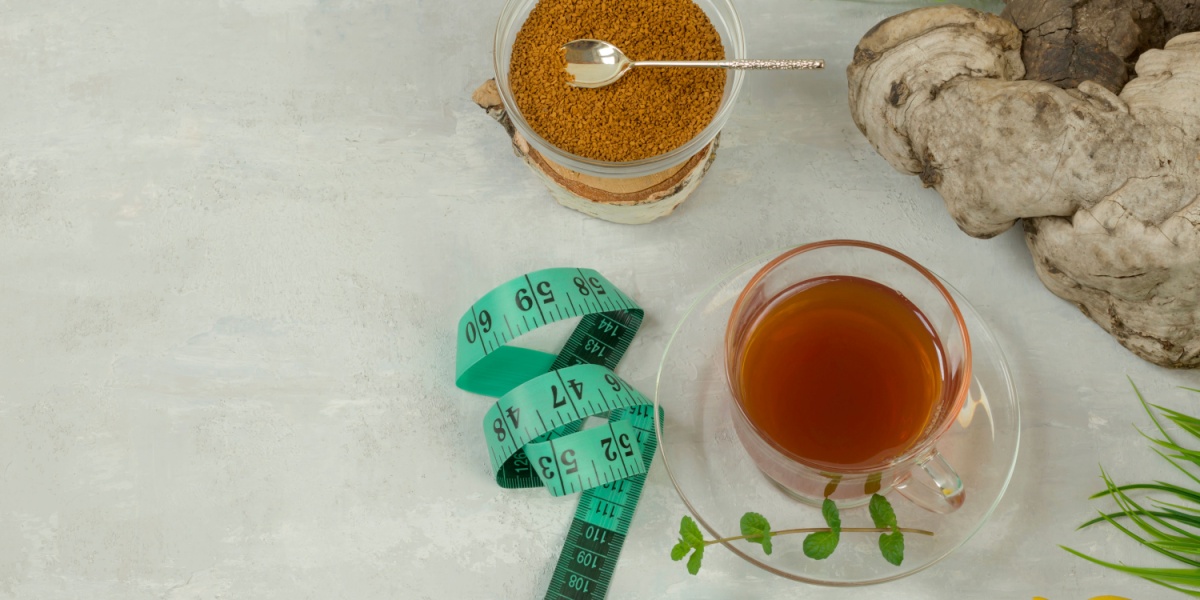 a top-view photo of a table with a tape measure and psilocybin mushrooms