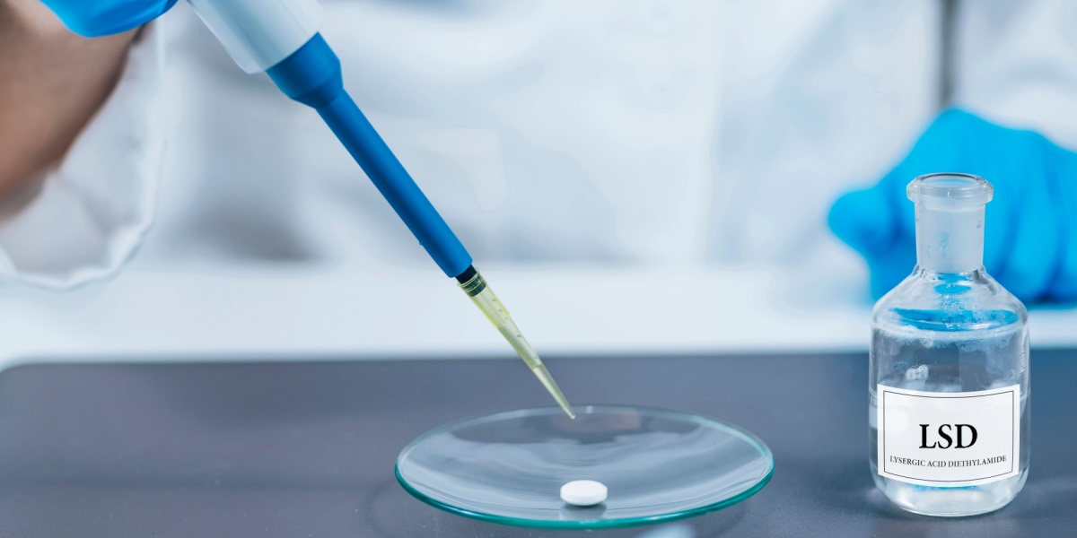 a photo of LSD in a glass vial and a scientist in a lab