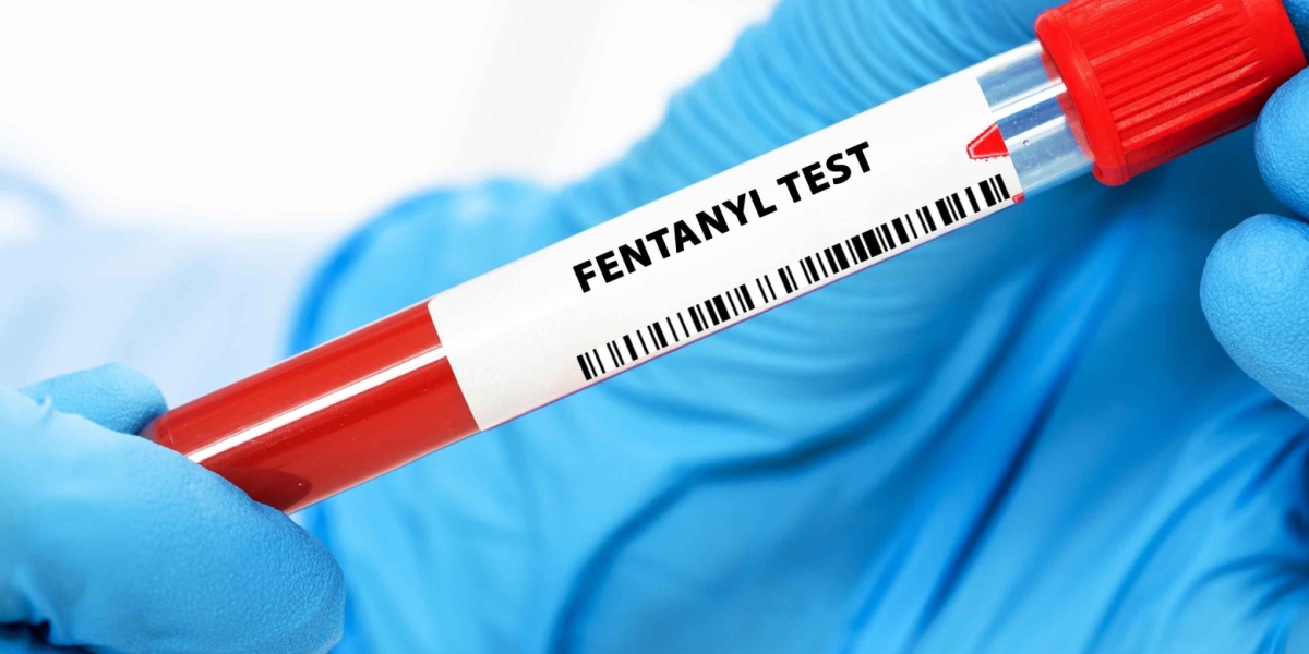 a close up photo of a gloved hand holding a test tube with the text Fentanyl test