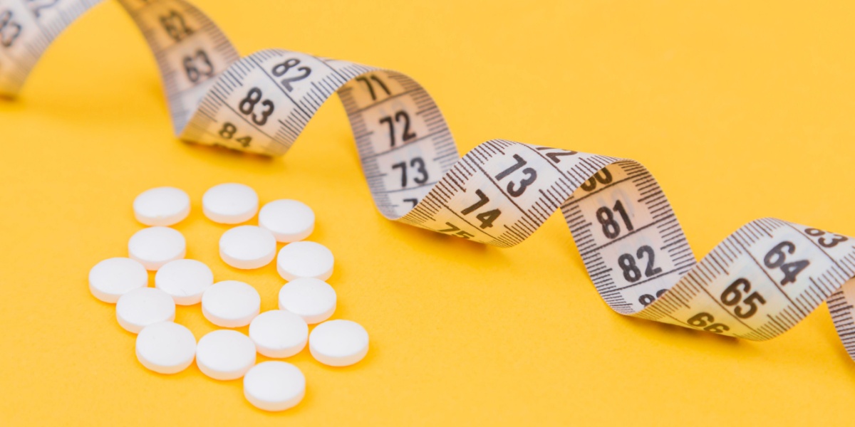 a photo of Lexapro pills and a tape measure against a bright yellow background