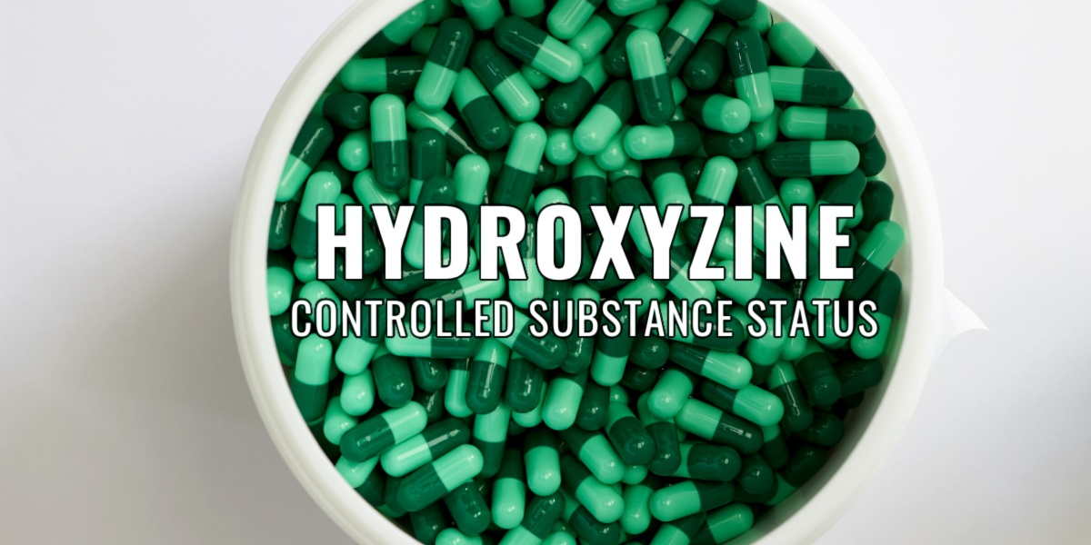 a top view of a container filled with hydroxyzine pills, it has the text