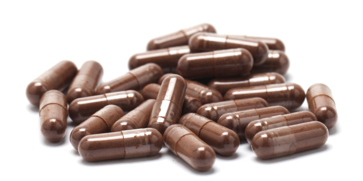 a close up photo of several brown venlafaxine (Effexor) capsules