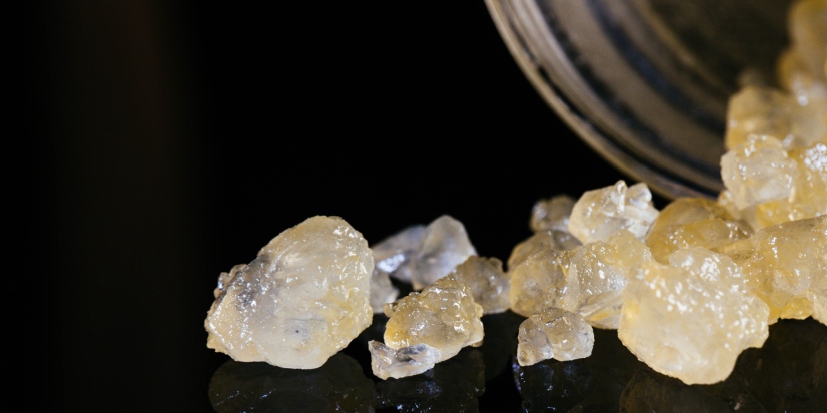 a close up photo of THC diamonds on a black background