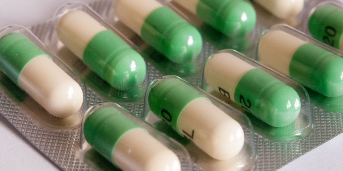 A close up photo of a blister pack full of Prozac or fluoxetine pills.